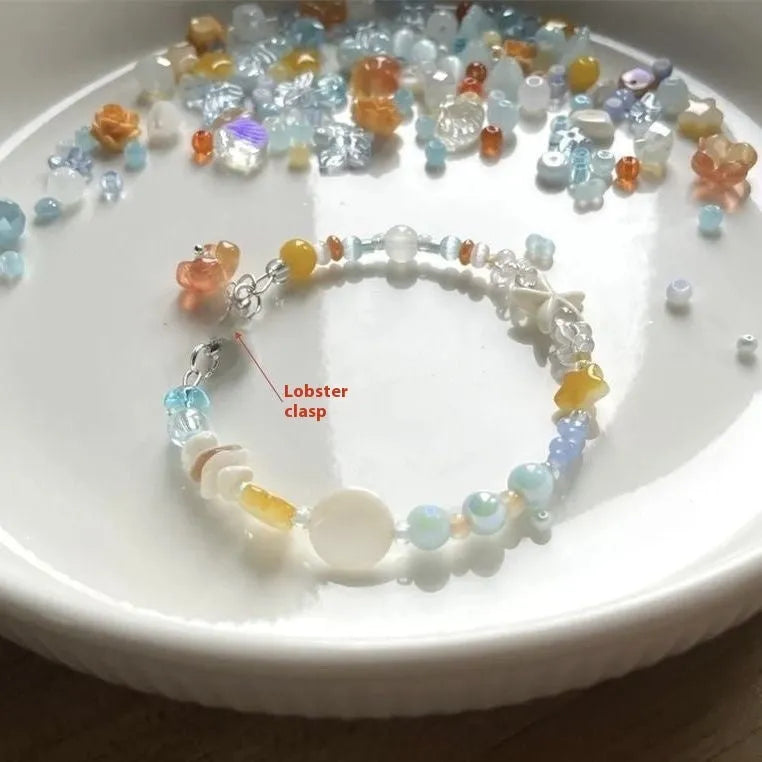 Orange alloy bracelet with diamond shape and round mixed material elements