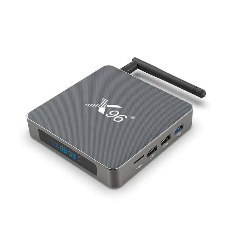 Android smart TV set-top box with remote control, HDMI cable, and power adapter on a table.