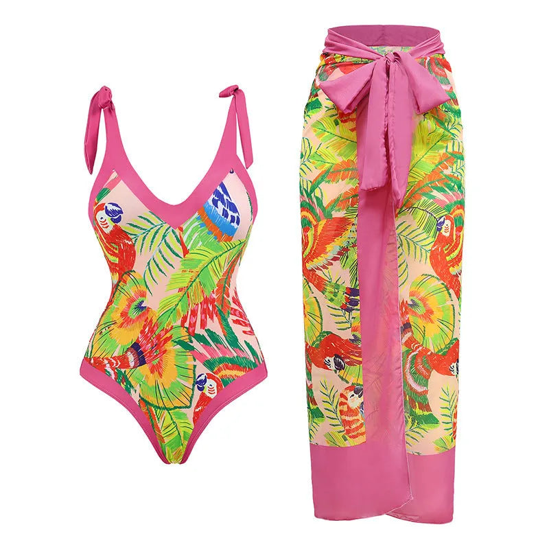 Retro pink floral print women's one-piece swimsuit with V-neck and attached thin skirt.