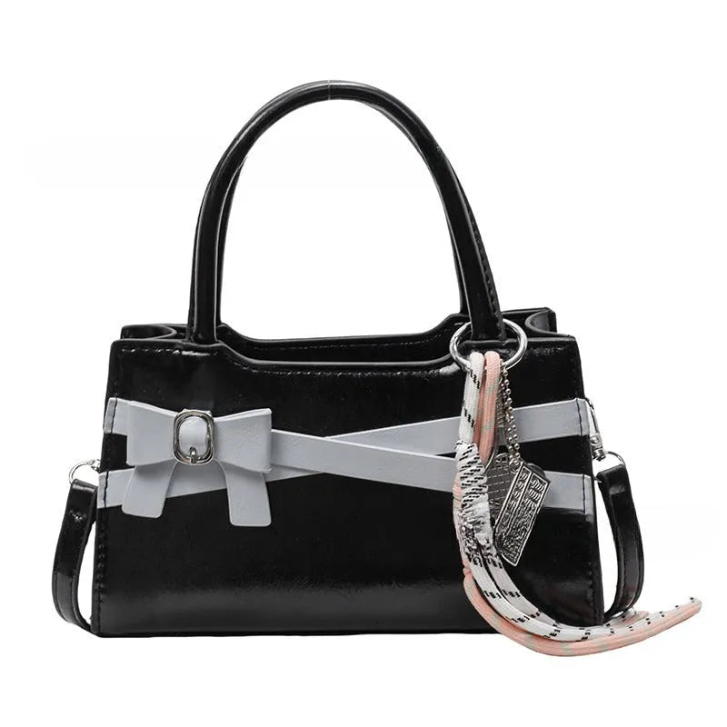 Soft nylon crossbody bag in urban simplicity, horizontal square shape, beige colour with flap pocket and stitching details.