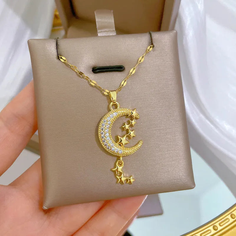 Moon pendant necklace with geometric tassel design and diamond embellishment on stainless steel chain