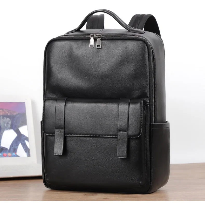 Men's black genuine leather computer backpack with woven detailing and physiological curve back plate