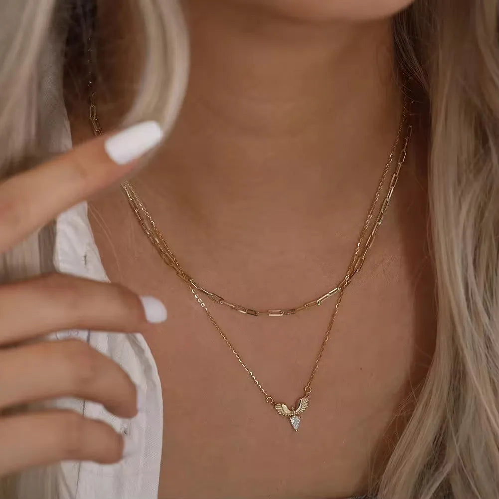 Close-up of a women's sterling silver necklace with an eagle pendant on an O-ring chain.