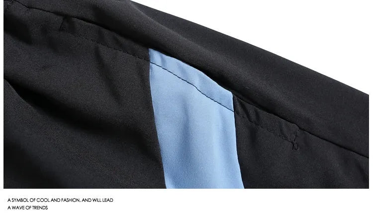 Men's black quick-drying sports shorts with elastic waistband in loose straight-leg cut above knee length