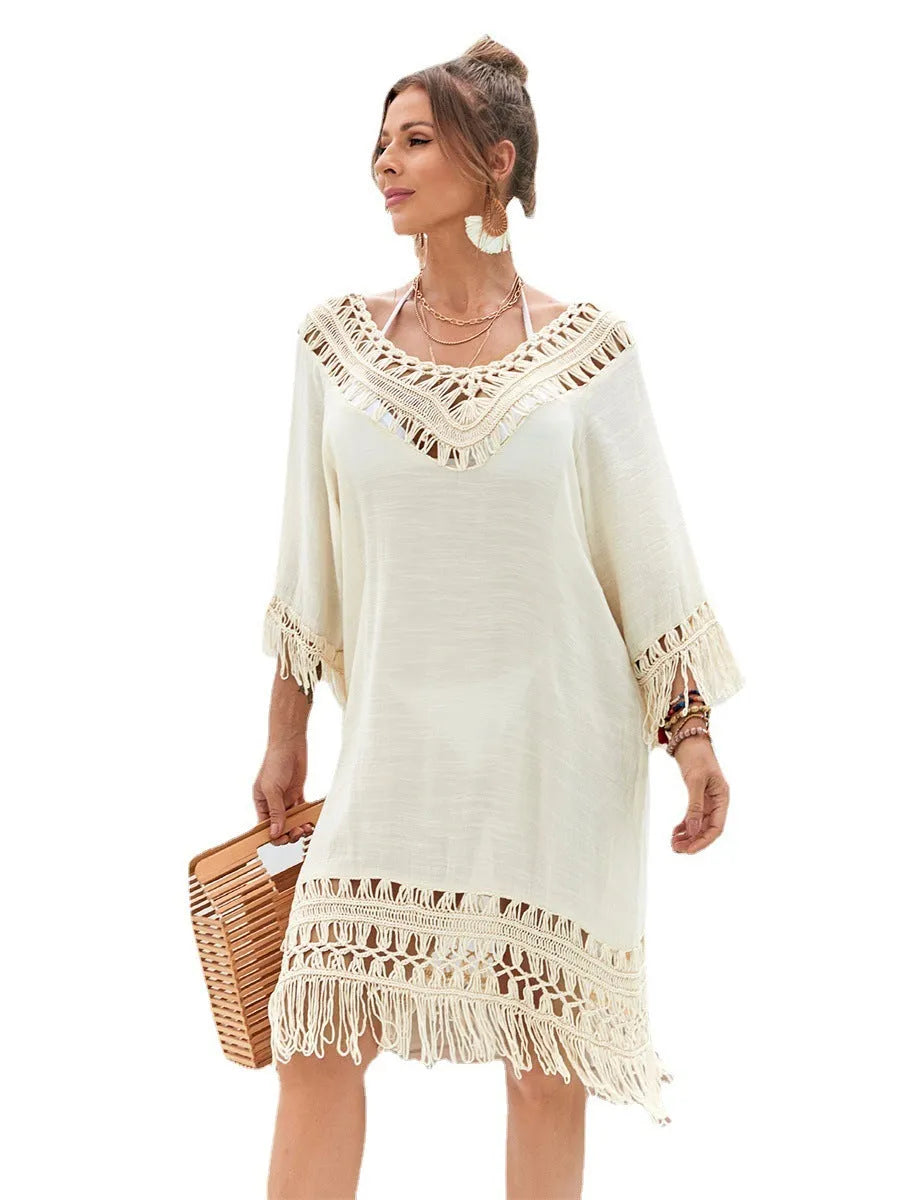 Apricot coloured hand-crocheted women's beach dress with lining on a mannequin