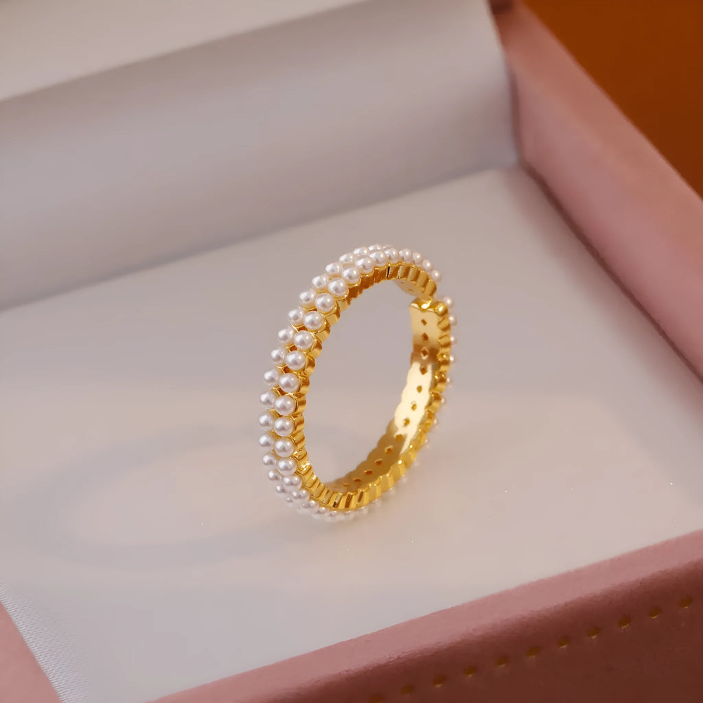 Gold geometric open mouth women's ring with round pearl design elements on copper base