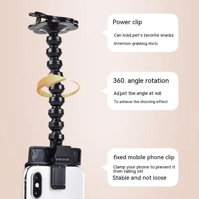 Pet photography selfie stick with clip for snacks in black plastic, showing phone holder and rotatable head