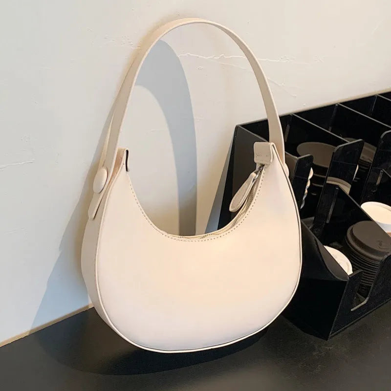 Women's retro dumpling-shaped shoulder bag in PU leather with zipper compartment interior