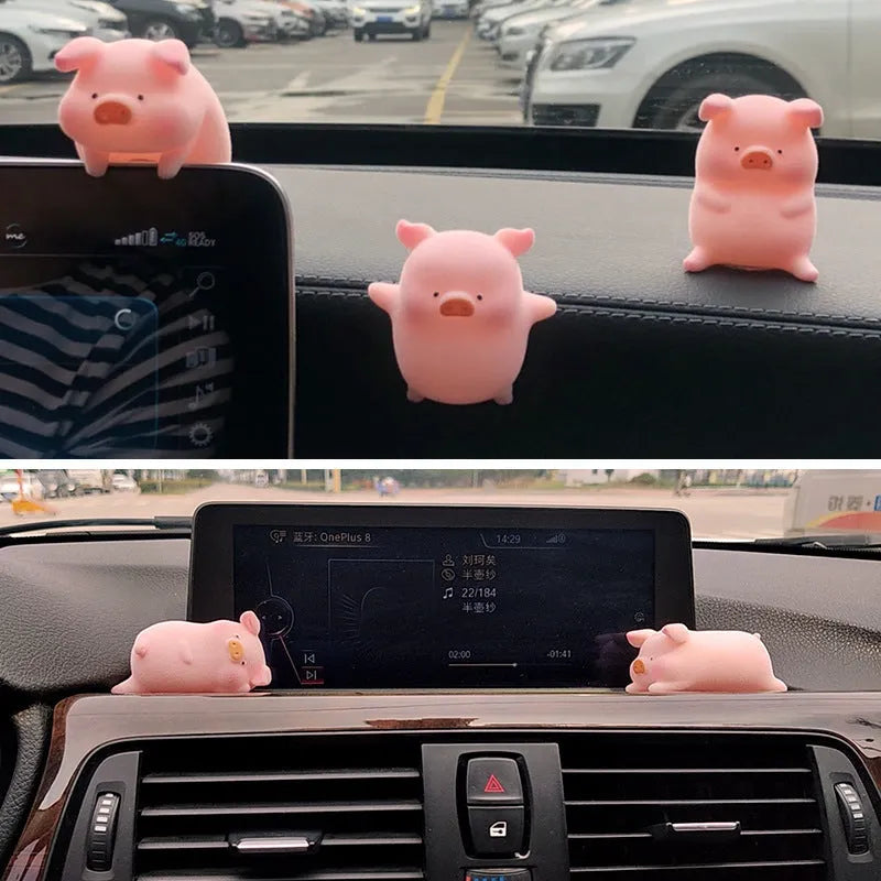 A cartoon pig figurine car dashboard ornament made of resin.
