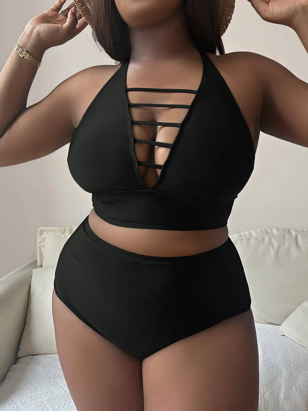 Plus size women's bikini with adjustable halter straps and high waist bottoms in solid colour