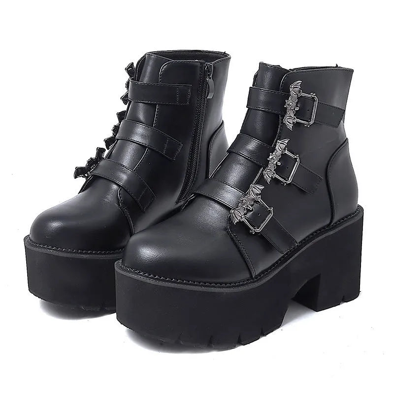 Black women's punk ankle boots with bat buckle decoration and side zip closure