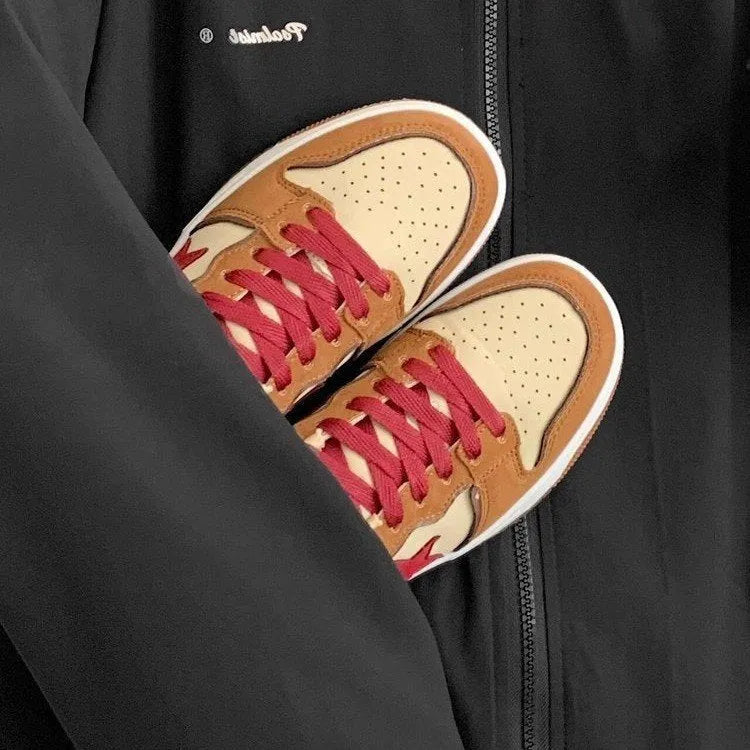 Brown low-top platform sneakers with sequins, lace-up fastening, and rubber sole on light background
