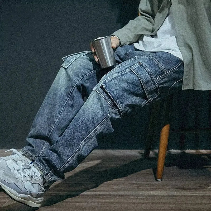 Man wearing blue loose straight-leg retro style stretch denim casual trousers