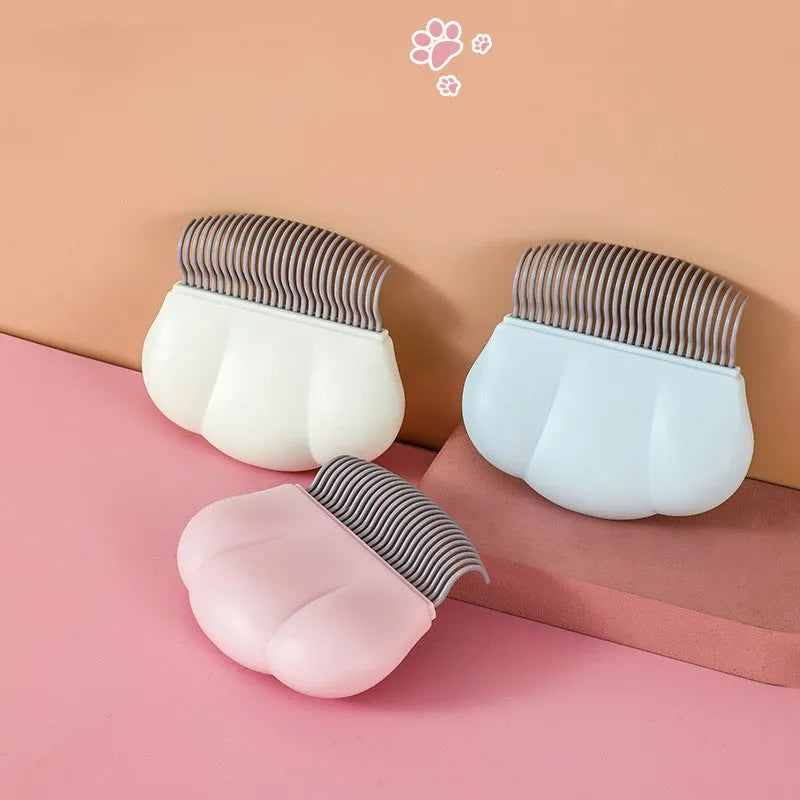Paw Soft deshedding and matted fur remover brush for cats and dogs in blue, pink or white.