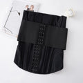 Nylon belly band waist trainer in black, showing adjustable belt tie fastener.