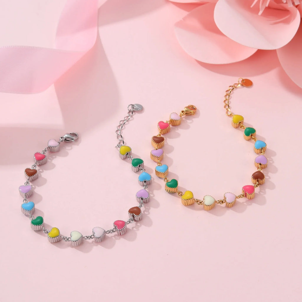 Women's titanium steel bracelet with oil-filled heart pendant in gold or steel finish