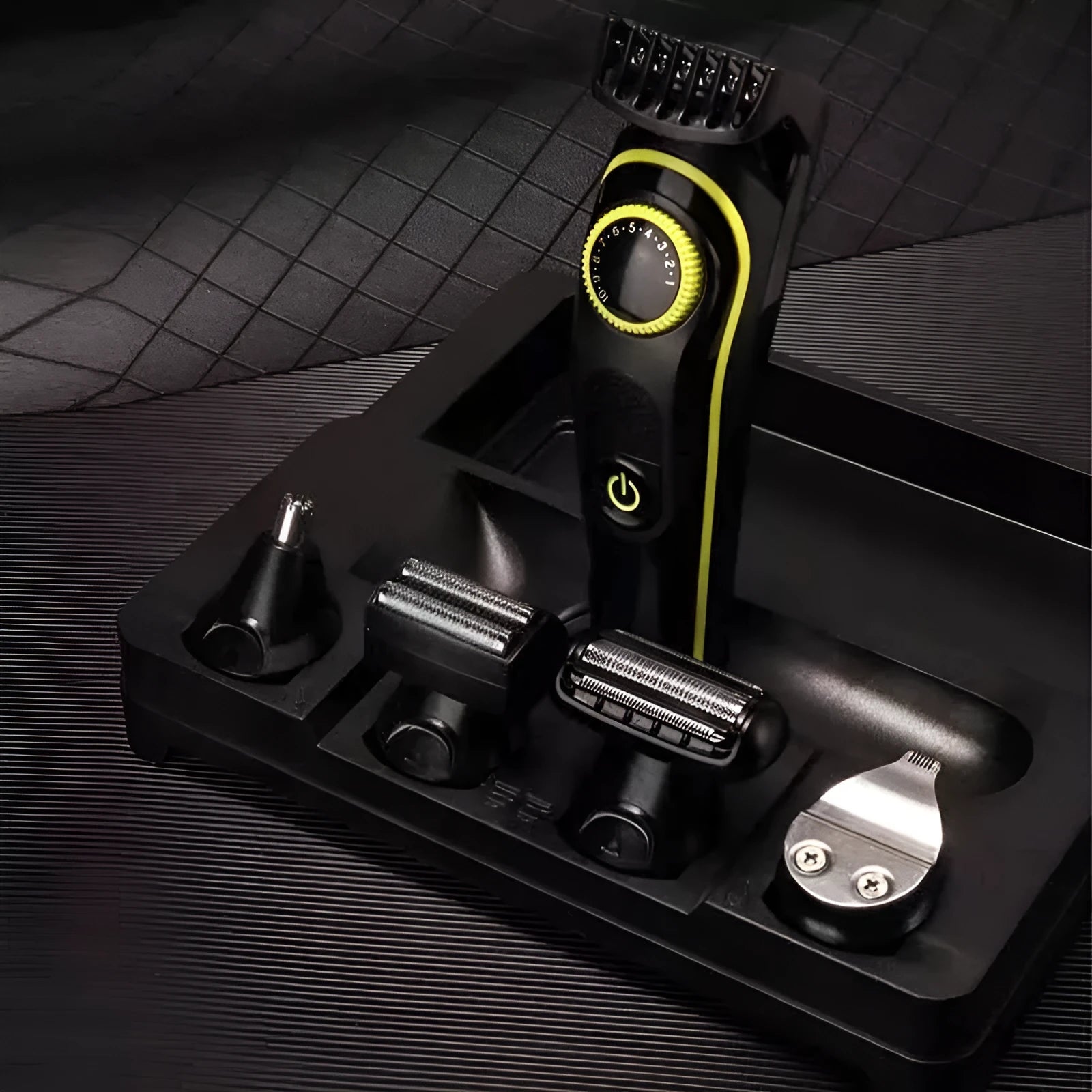 Black KM-696 rechargeable electric hair clipper with stainless steel blades on a white background.