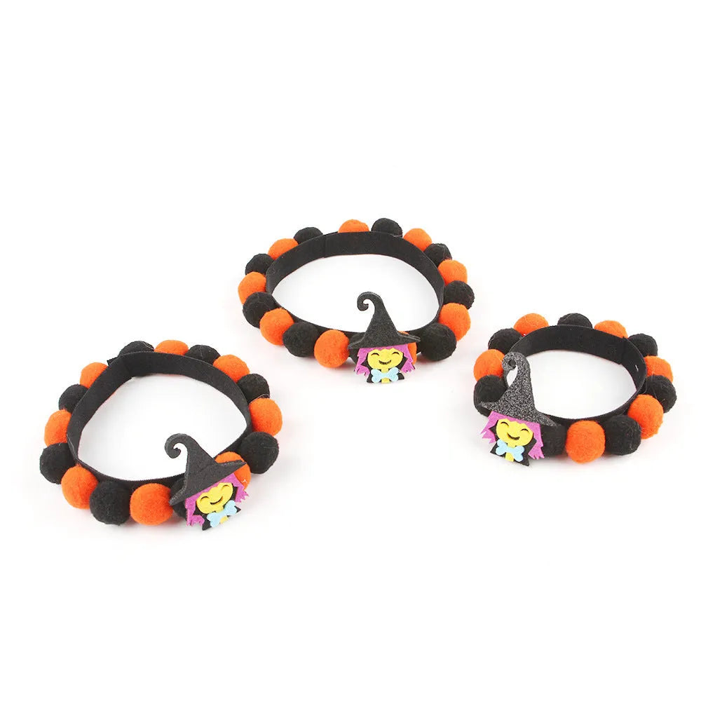 Halloween pet fur ball collar in coarse powder pumpkin colour on a cat, with soft textured design