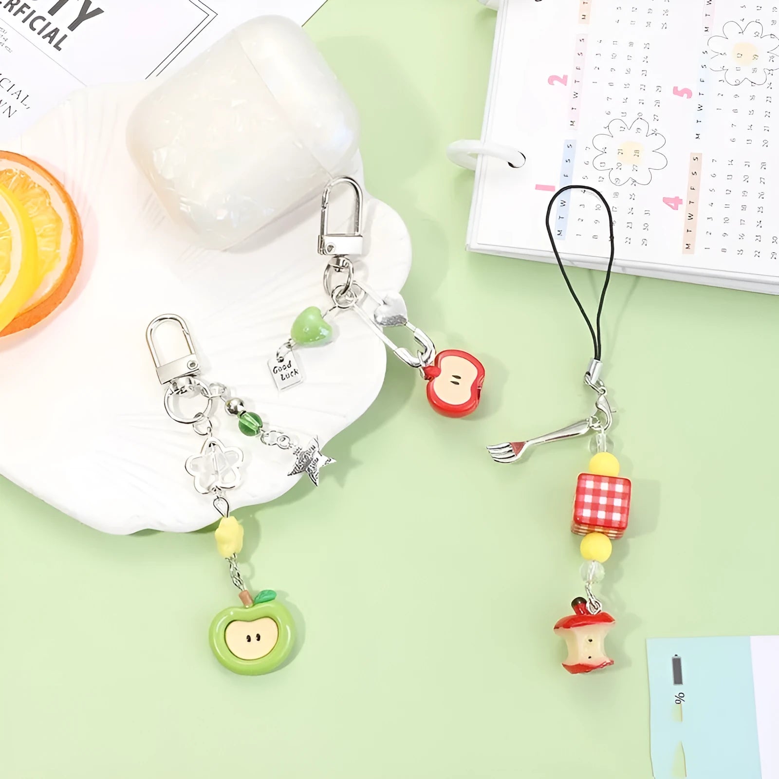 Mobile phone earphone bag pendant keychain with fruit designs including apple, strawberry, and apple core patterns