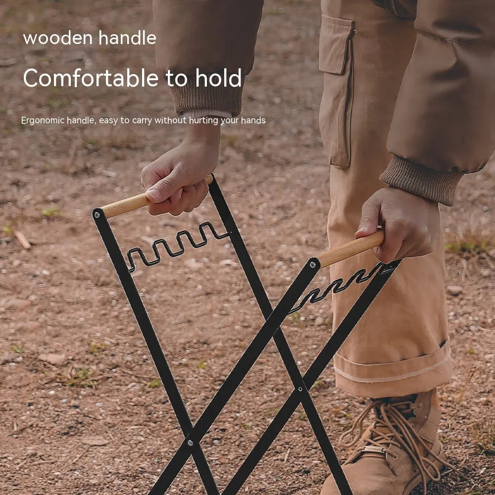 Black outdoor iron trash hanger with wooden handle in a folded position.