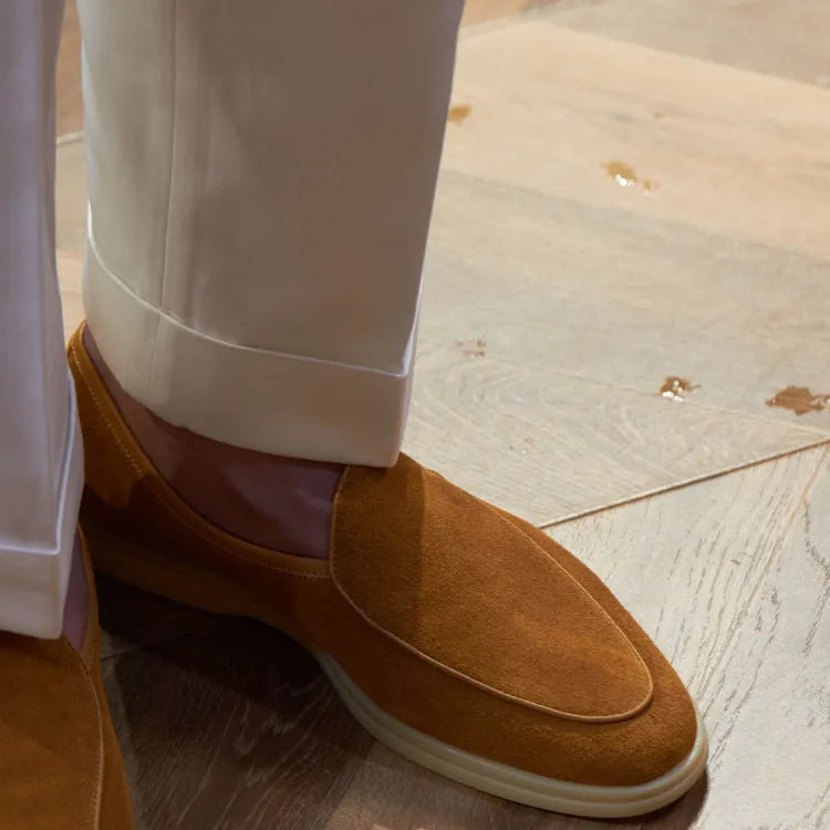 Men's handmade leather loafers in brown with TPR sole on wooden surface