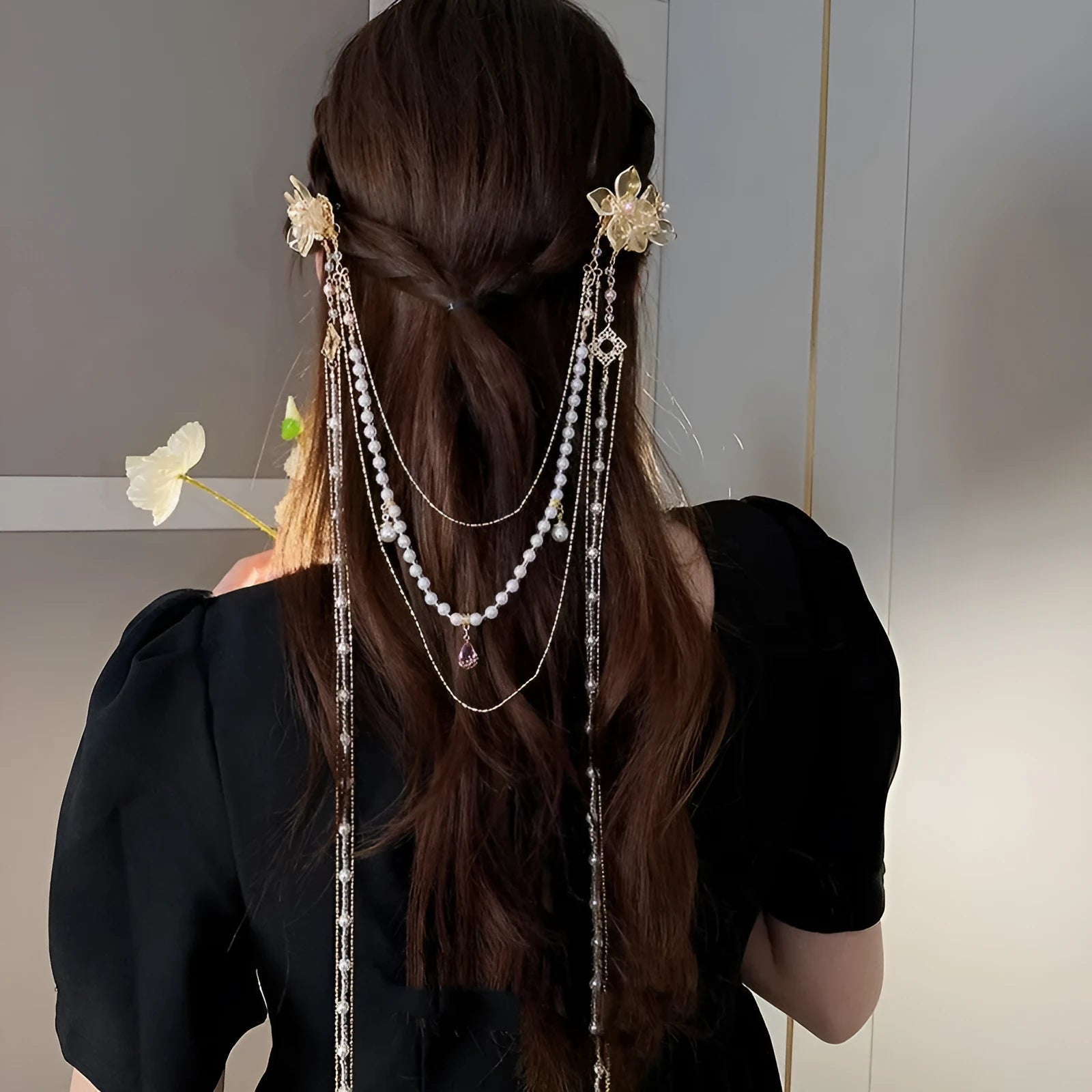 Gold women's hairpin with white pearl and clear diamond floral decoration and a long dangling tassel