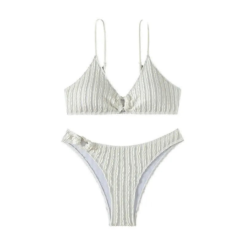 White women's V-neck bikini set with sleeveless top and shorts on a plain background.