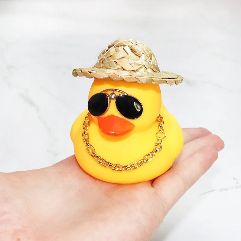 Straw hat yellow duck cartoon car dashboard ornament with adhesive gel and sunglasses necklace.