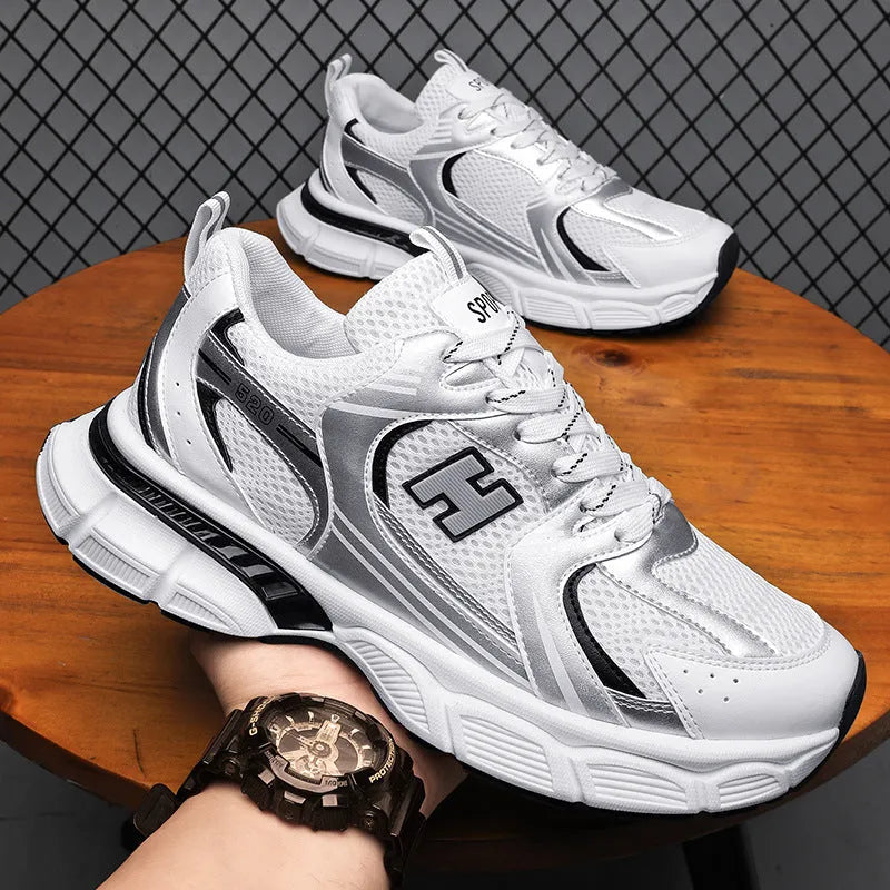 Men's white and gray mesh casual running shoes with a round toe and injection moulded plastic sole.