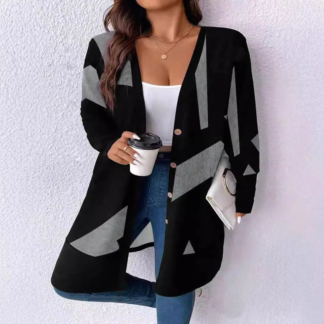 Black loose fit plus size knit cardigan with button detail on a hanger.