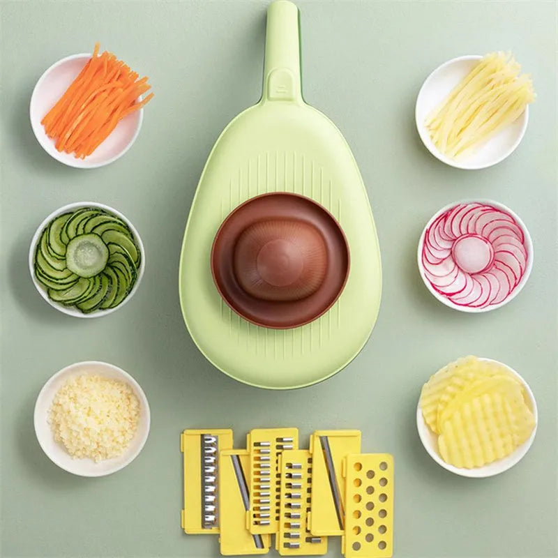 Vegetable grater slicer with six sabres and bottom storage box in avocado green colour on a kitchen counter