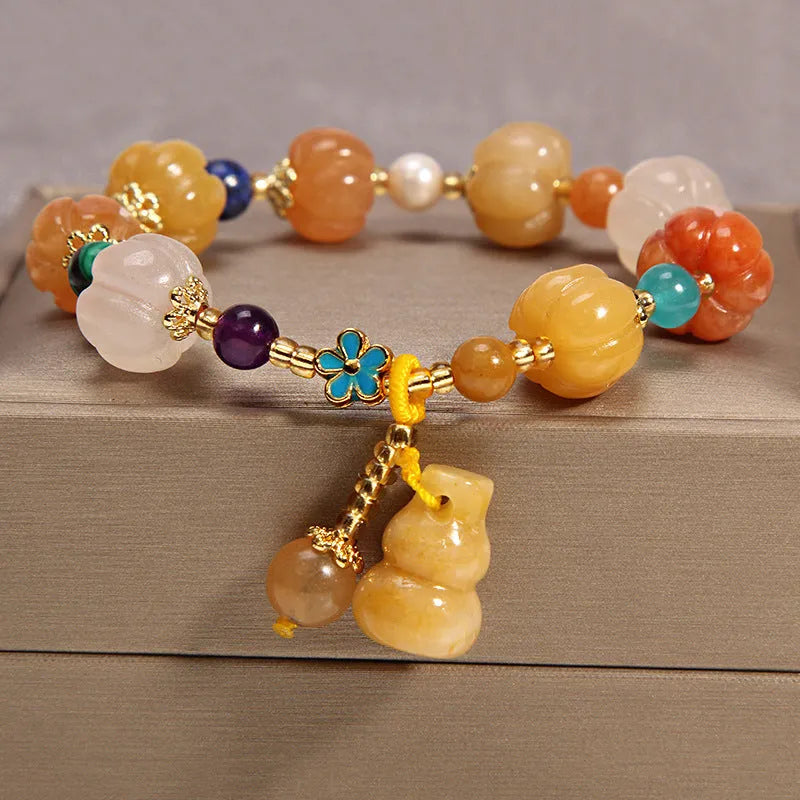 Yellow agate crystal bracelet with gold silk threading on wrist