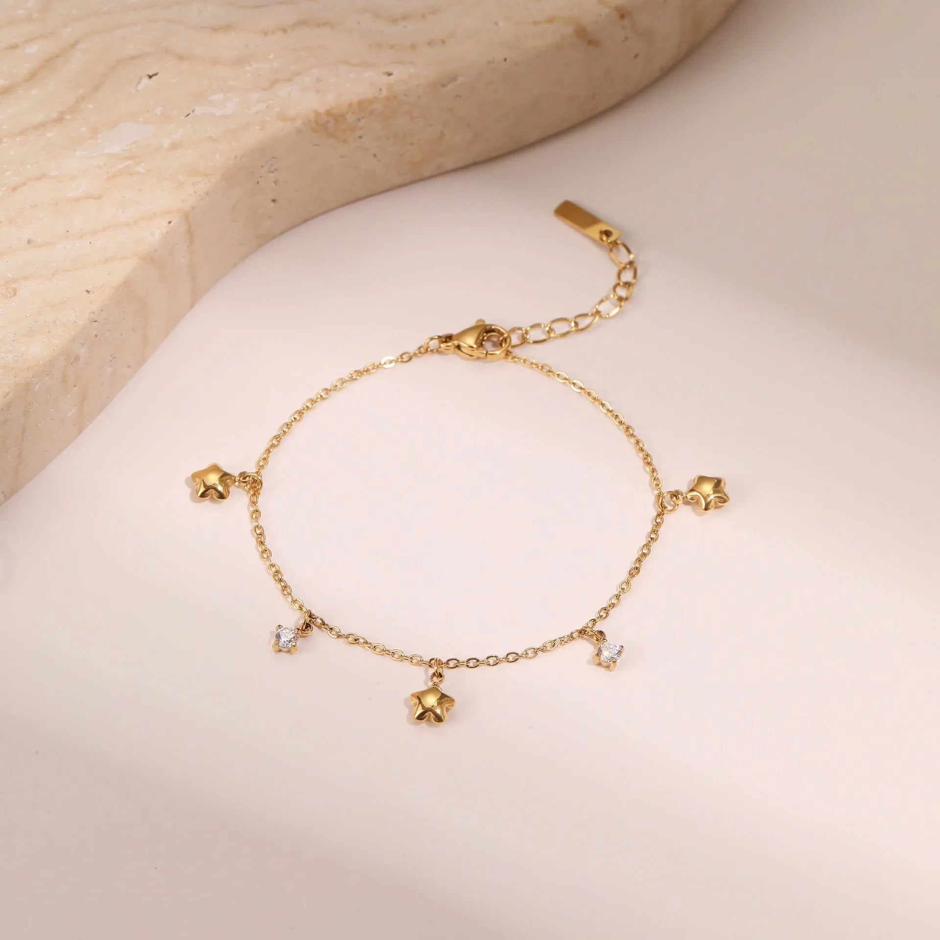 Women's stainless steel bracelet with 18K gold plating and geometric star zircon pendant