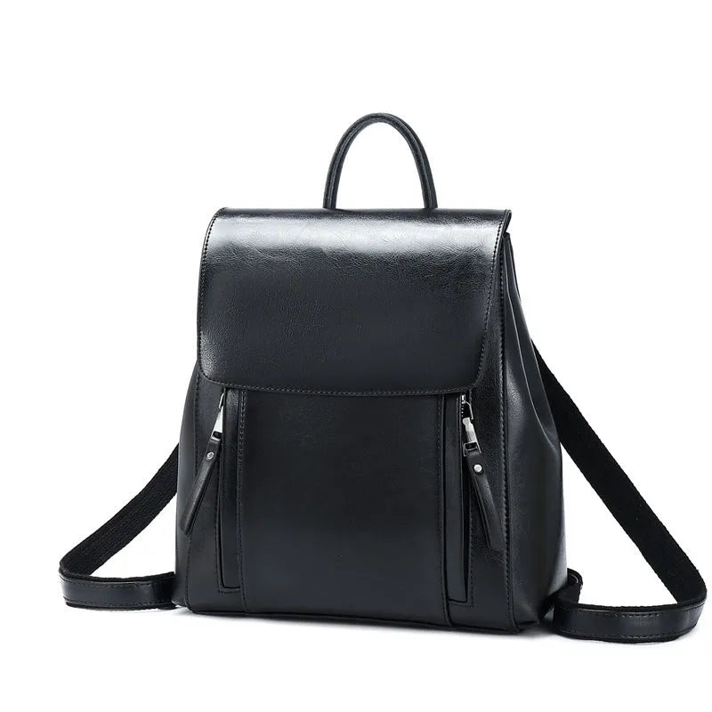Large black genuine leather women's backpack with double straps and stitching detail.