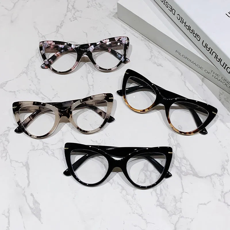 Women's large frame cat's eye reading glasses with dragon and phoenix decorations on the temples.