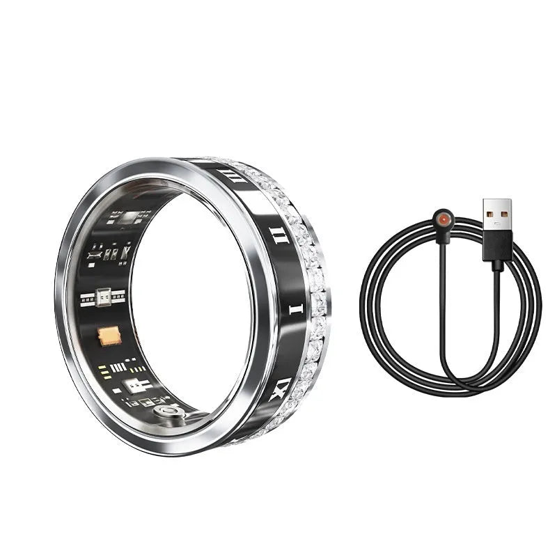 Gold and silver smart ring with diamond inlay on a finger, showing charging cable and box