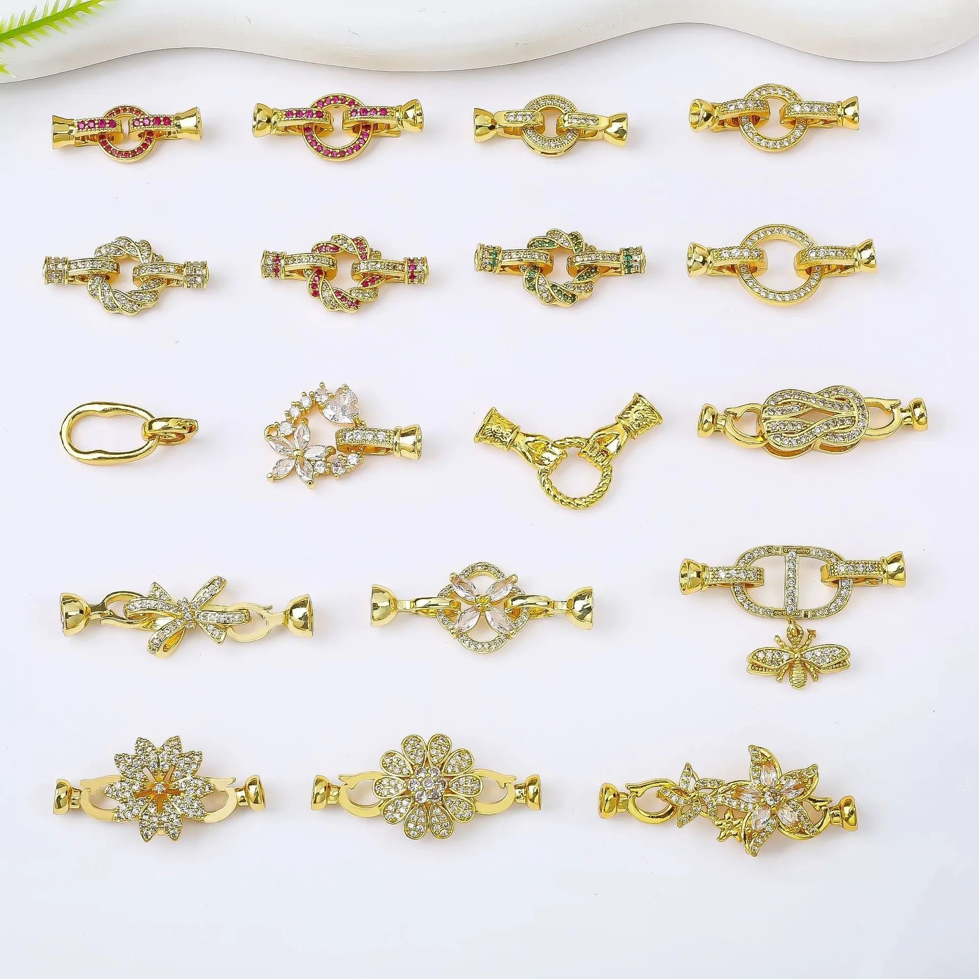 Small gold-coloured jewellery clasp and end hook for DIY necklace or bracelet making and repair.