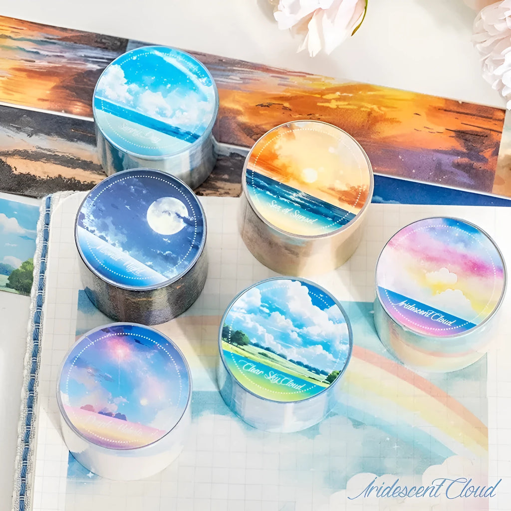 Roll of Japanese paper decorative washi tape with sky theme designs, showing colourful clouds, sunny day, and twilight patterns.