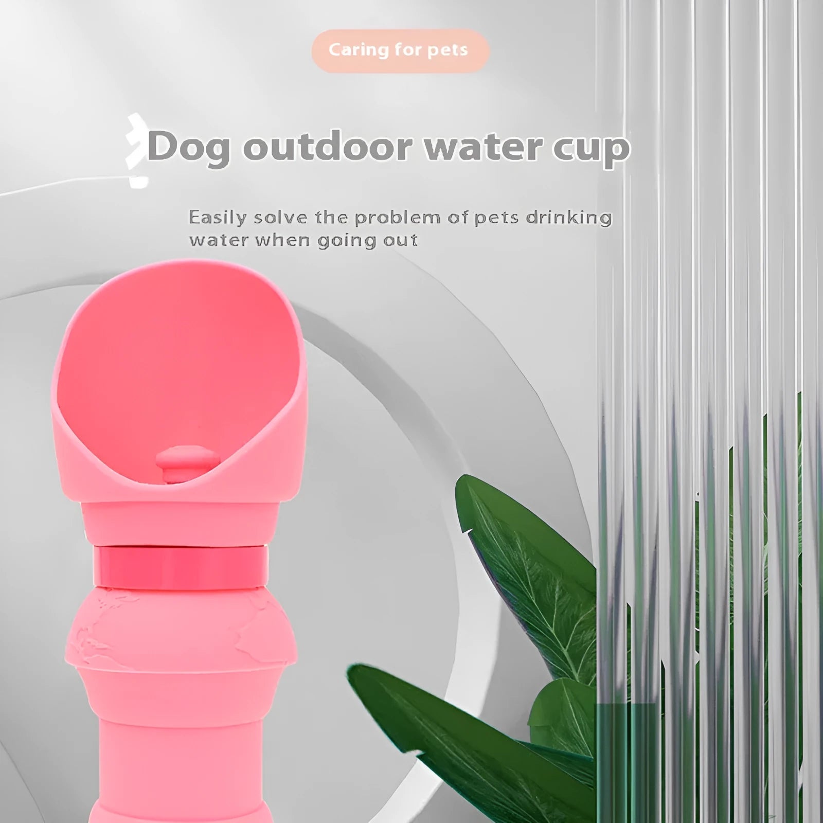 A collapsed flat and an opened pink silicone folding pet water cup on a grey background.
