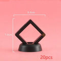 Transparent 3D floating display case holding a coin, with black and white size options