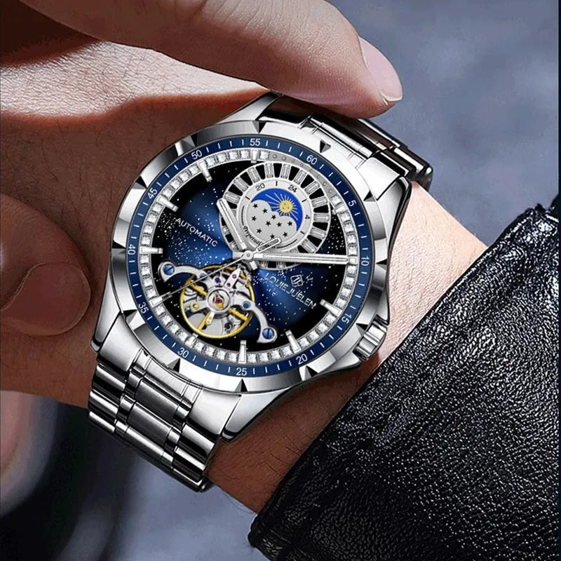 Silver alloy automatic mechanical watch with blue dial and stainless steel strap on wrist