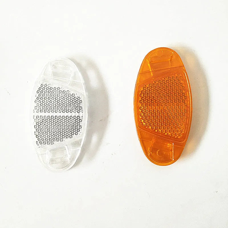 Plastic bicycle spoke reflector strips in white and yellow colours measuring 7.2cm long