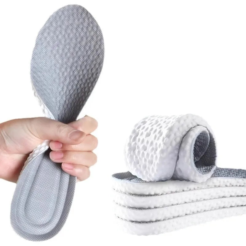 Breathable PU sports insoles in grey, black and orange colours with trim-to-fit edges