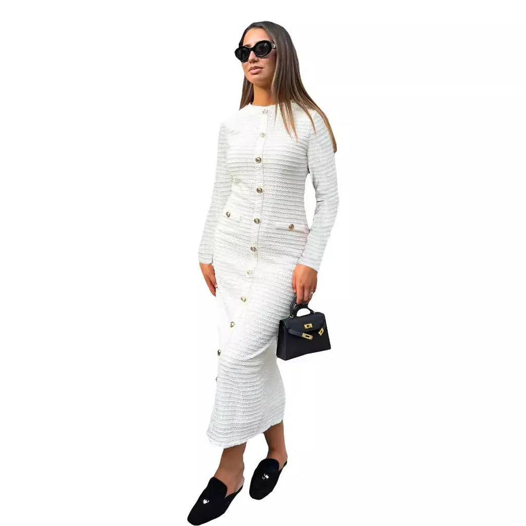 Black knitted long-sleeved slim fit dress with button detail on a mannequin.