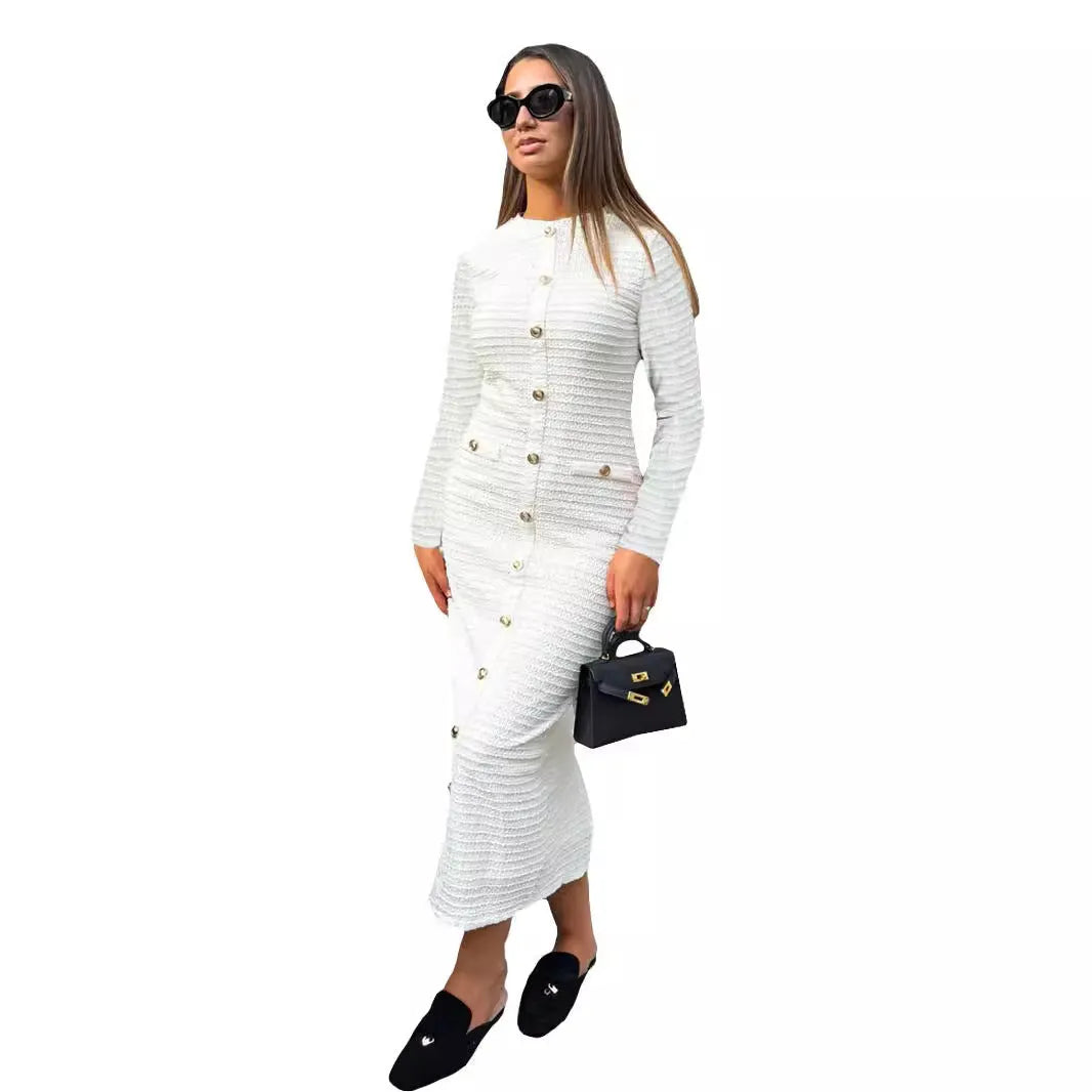 Black knitted long-sleeved slim fit dress with button detail on a mannequin.