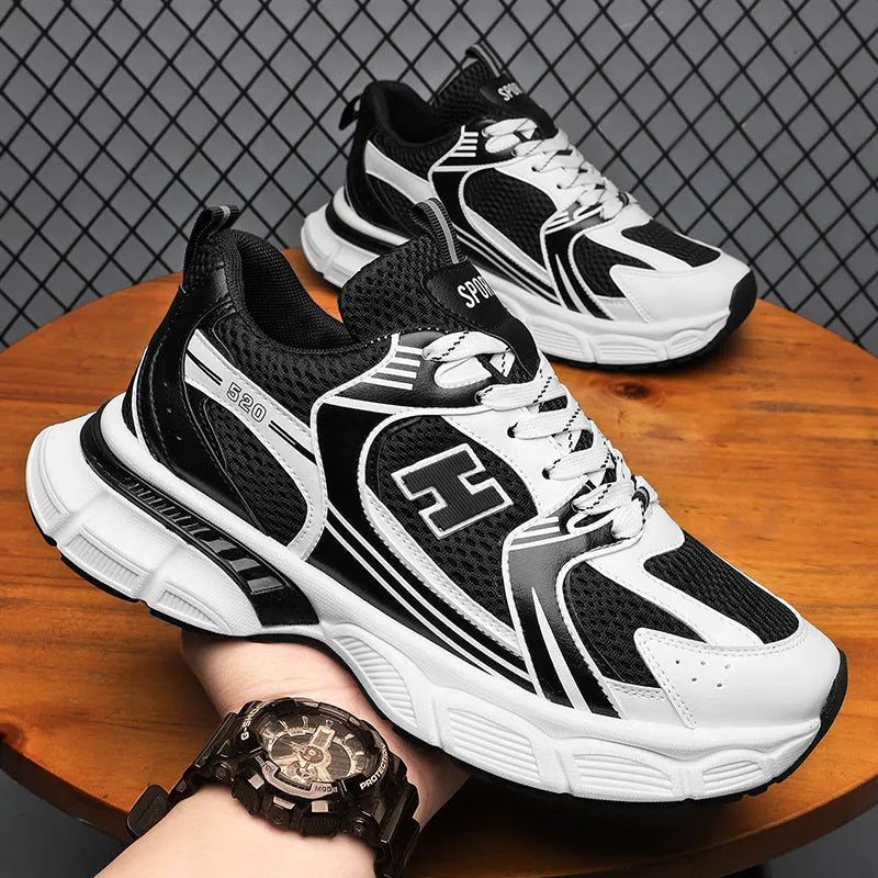 Men's white and gray mesh casual running shoes with a round toe and injection moulded plastic sole.