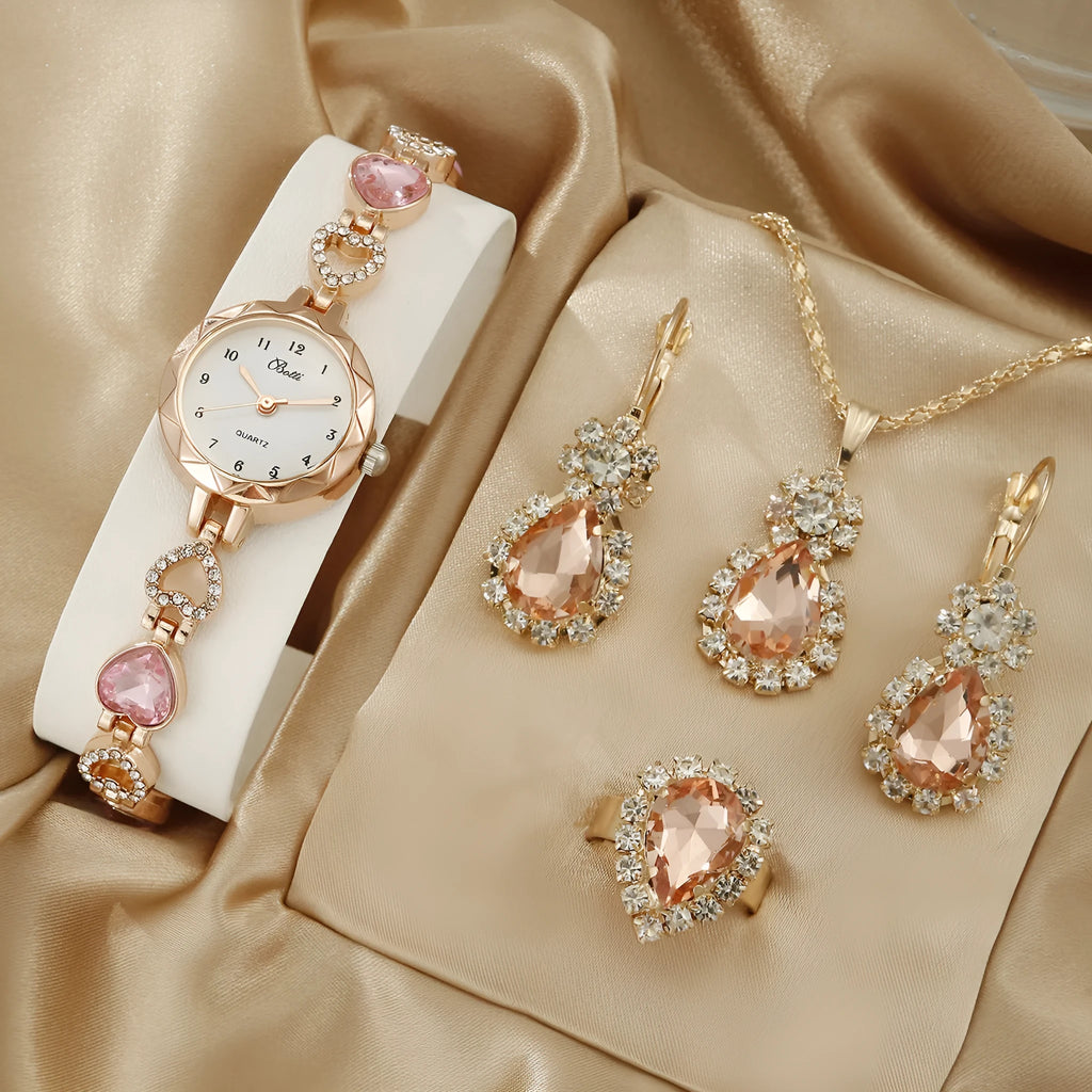 Women's simple disc light luxury quartz bracelet watch set in pink with matching earrings necklace and ring