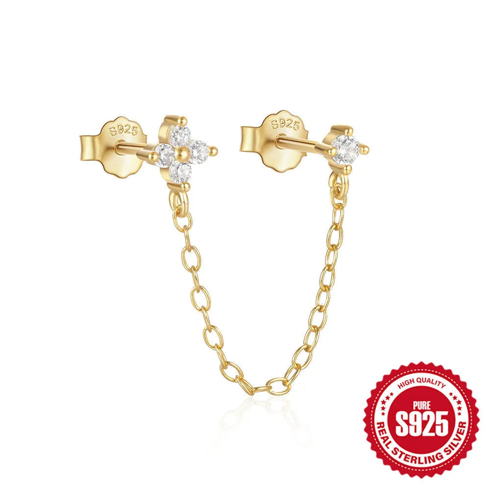 S925 sterling silver geometric drop earrings with flower, tassel, and chain details on an ear clip stud, in a golden tone.