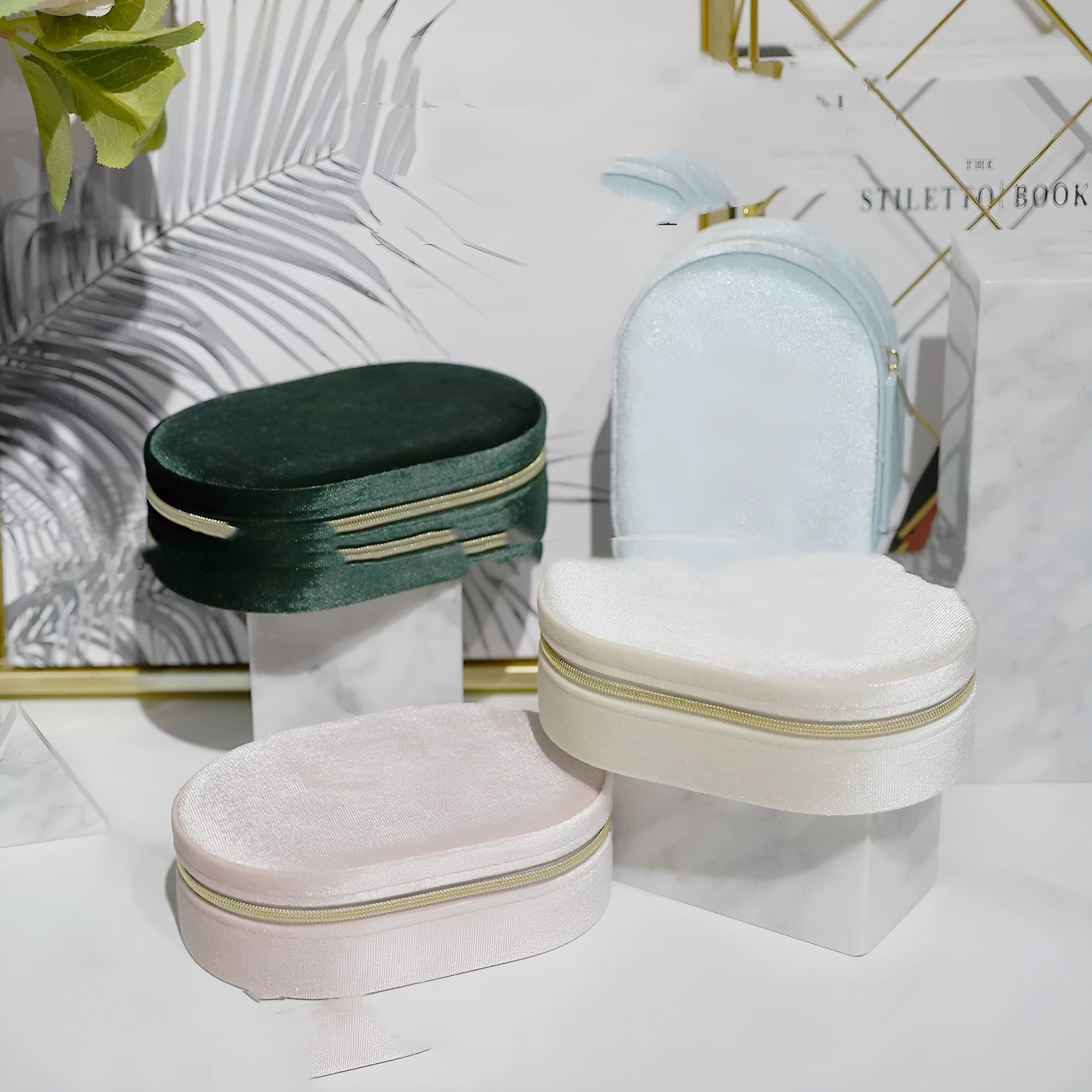 Oval-shaped velvet jewellery storage box with flannel lining, shown in lake blue colour.