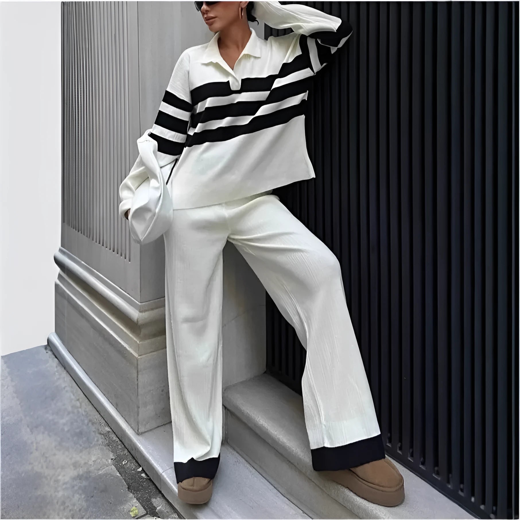 Women's black and white striped knitted two-piece set with polo collar and trousers